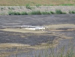 Typical waste lagoons at the start of surface aeration and microbial enhancement. Note the presence of solids on lagoon surface.